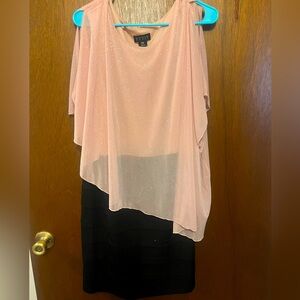 Black pencil dress with glittery pink overlay. Knee length dress.